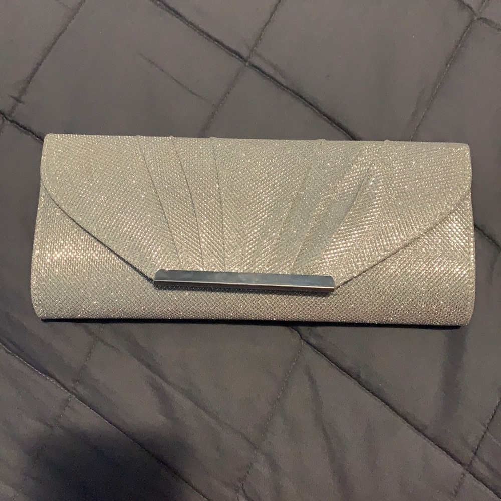 Never used Call it Spring Clutch, sparkly silver with shoulder chain